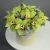 Композиция в шляпной коробке из 11 лаймовых орхидей в Протвино